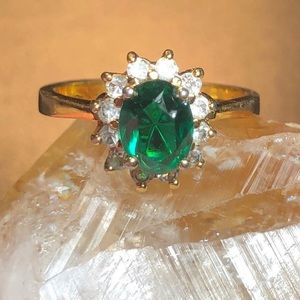 Gold tone ring with green stone